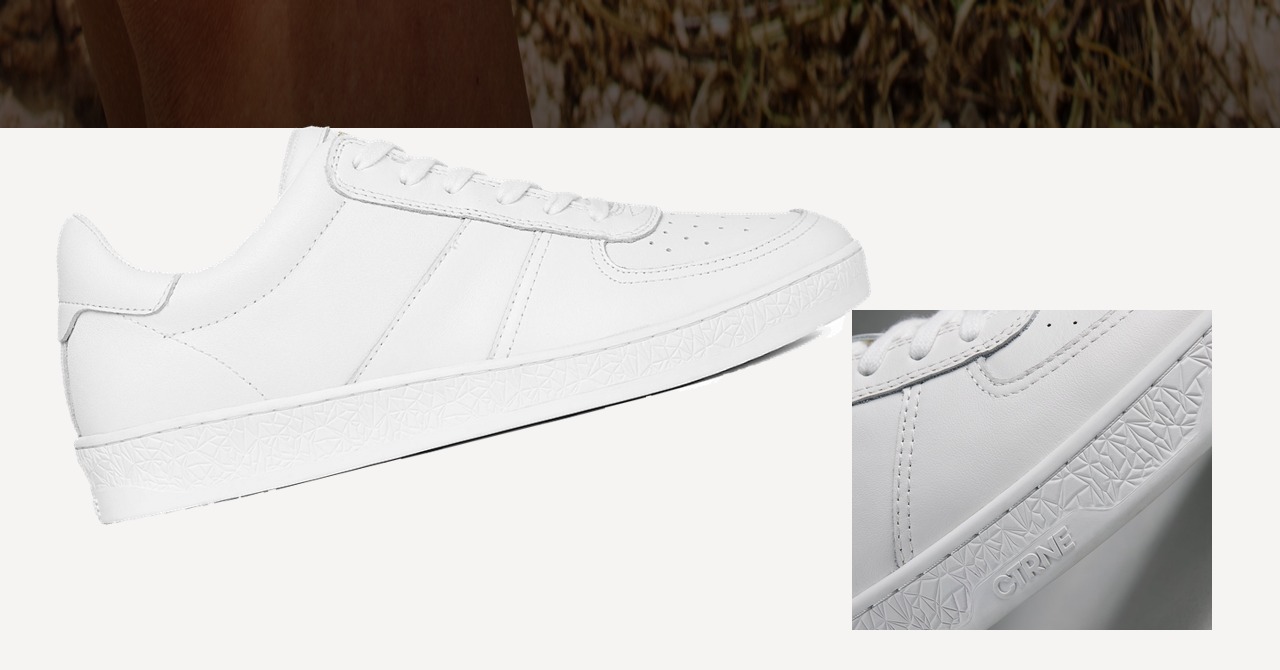 White Geode sneaker overlapping a close-up of textured leather and the embossed CTRNE sole.